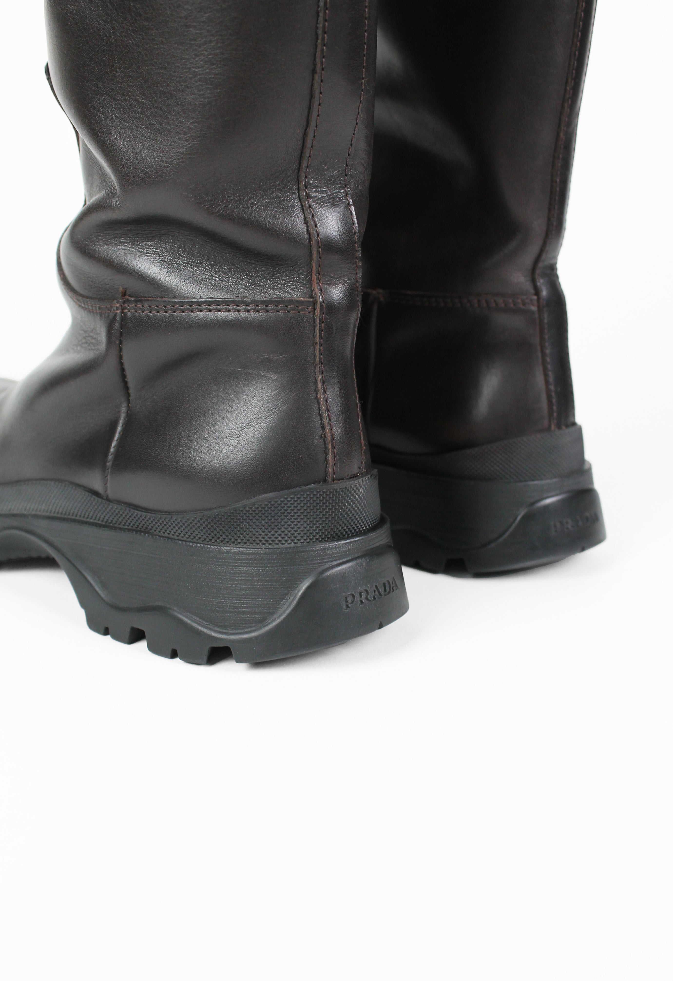 PRADA TALL BROWN LUG SOLE BOOTS